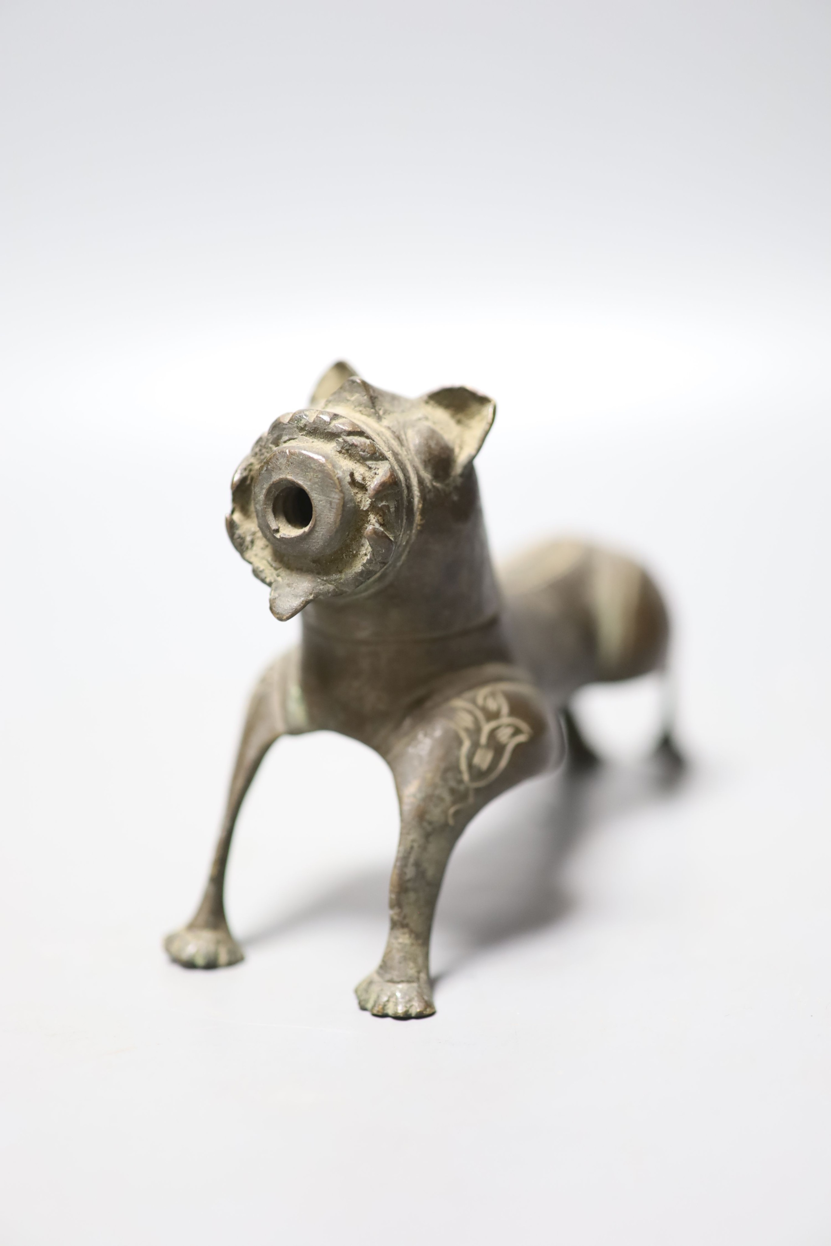 A Persian bronze tiger figure with incised detail, 16cm